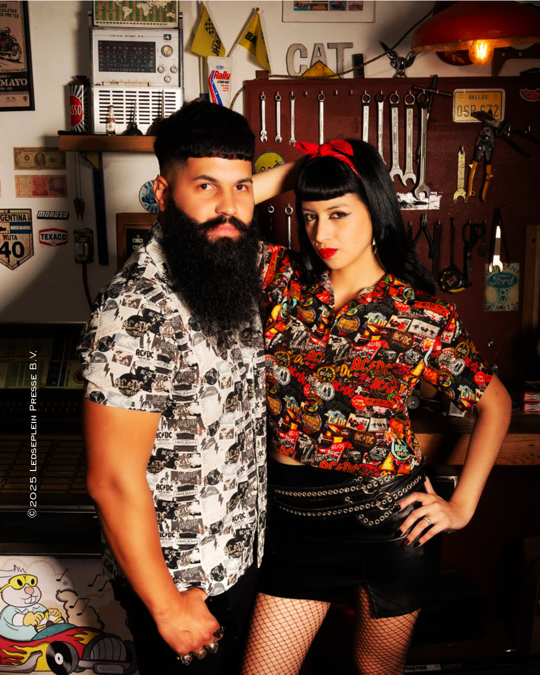 Models wear an AC/DC Rock or Bust shirt and a PWR/UP crop top.