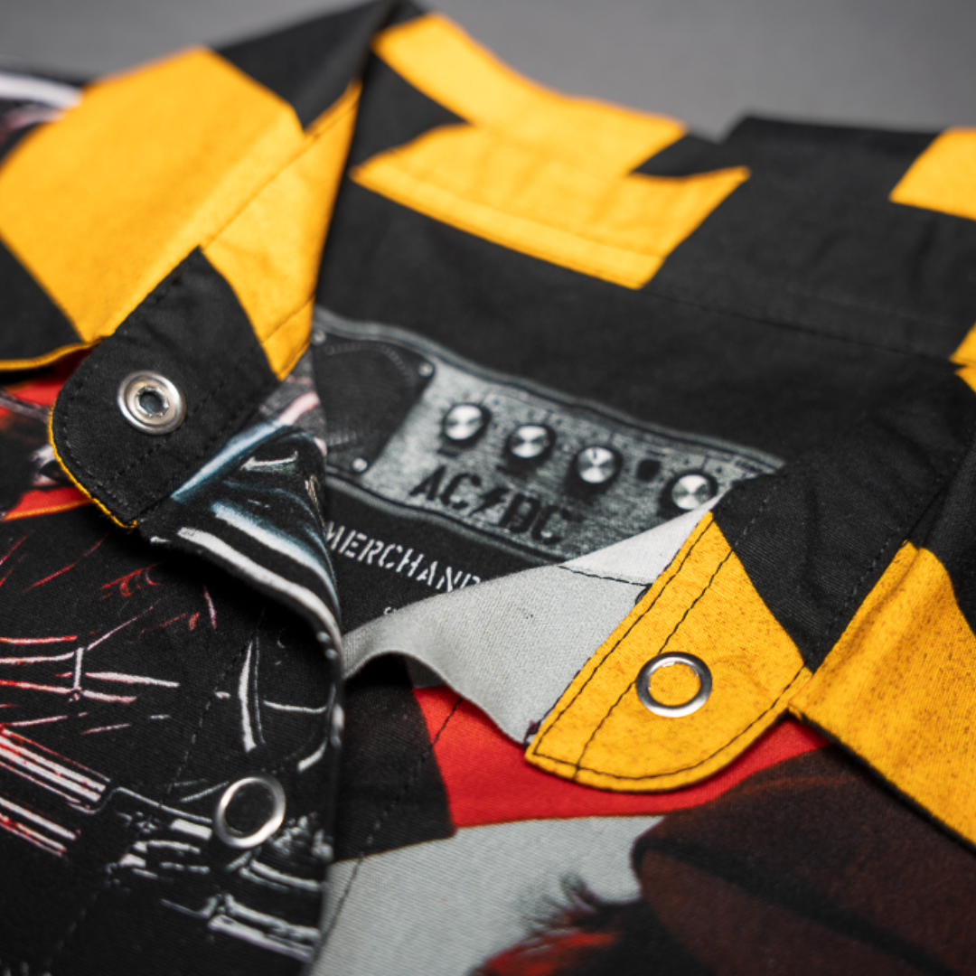 Close-up of a high-quality crop top from AC/DC. It features a PWR/UP style print. Not cheap merchandise, but high quality. 