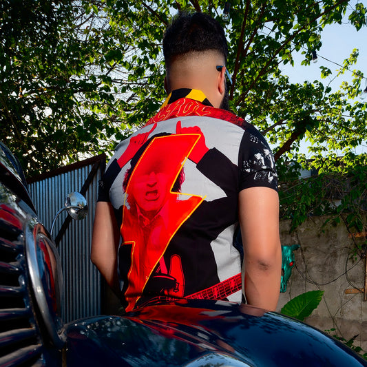 A rocker wears an AC/DC shirt. It has a PWR/UP style print. Not cheap merchandise, but high quality. 