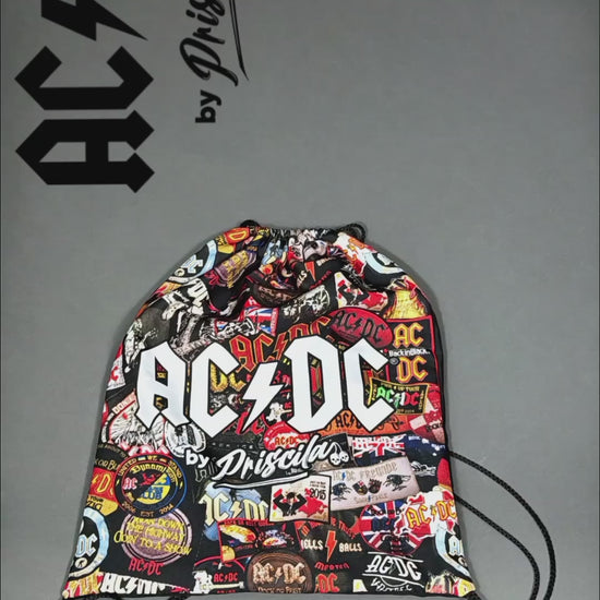 Unboxing video of a high-quality crop top from AC/DC. It is printed with lots of AC/DC patches. Not cheap merchandise, but high quality. 